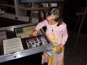 Not even pastry could distract this young guest from the new exhibit of medals and memorabilia of Corporal Szubert of the 1st Polish Independent Airborne Brigade during WW2